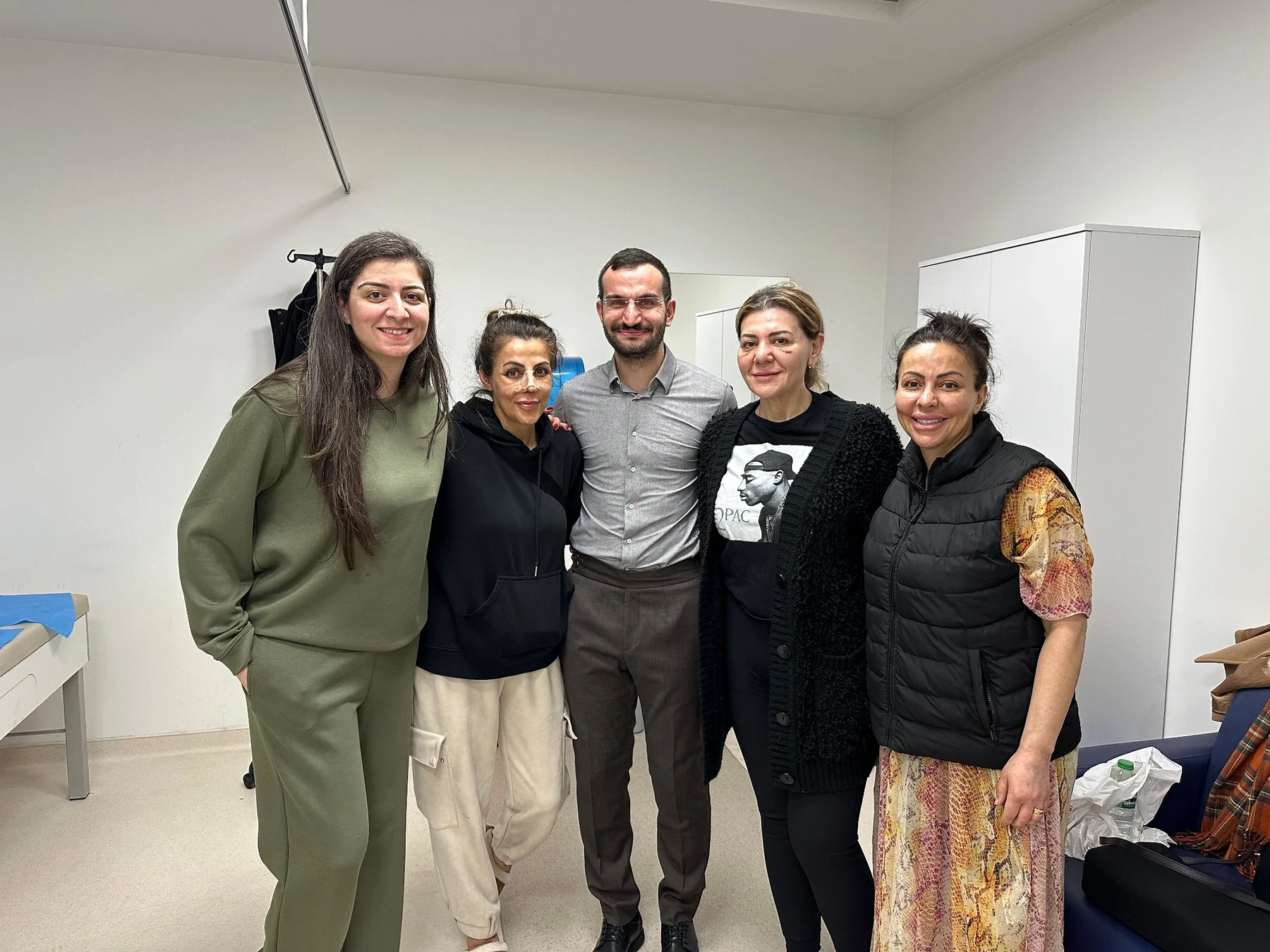 Dr. Ali Sadioğlu with a group of visitors at the clinic