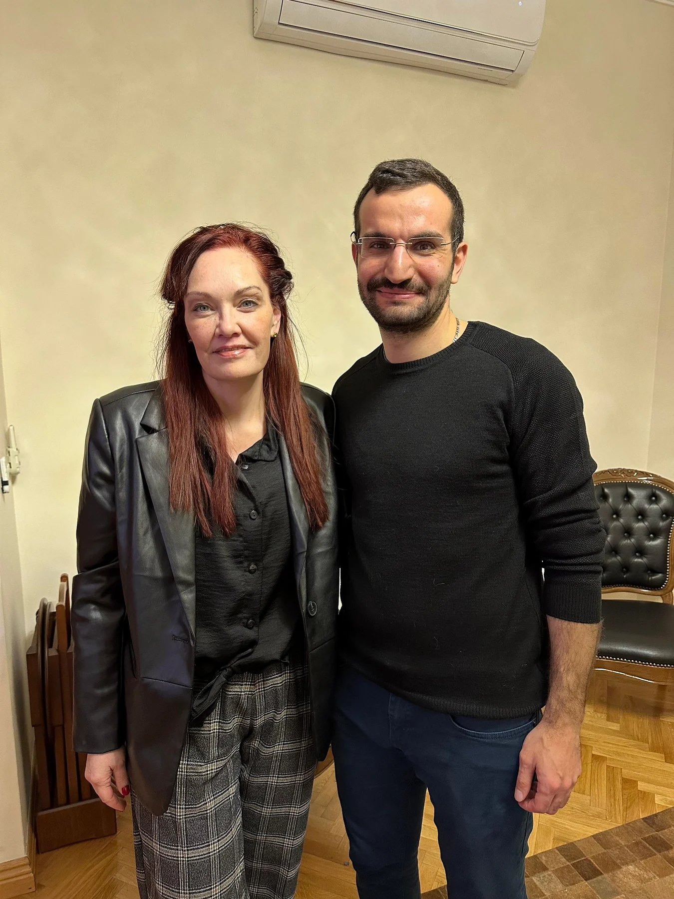 Dr. Ali Sadioğlu with a patient during a clinic visit
